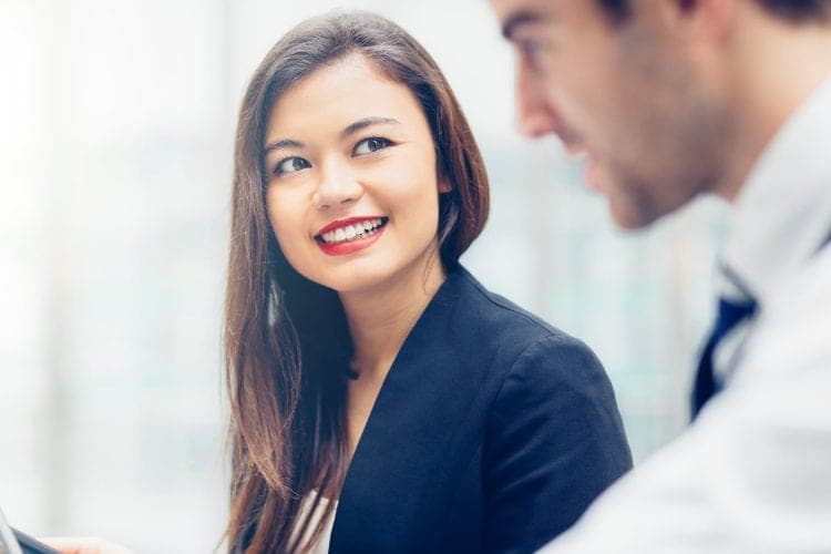 A business owner in conversation about growing her company's value