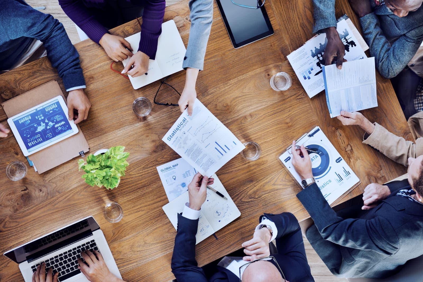 Business owners and advisers reviewing financial reports around a table ahead of the 2027 CGT changes
