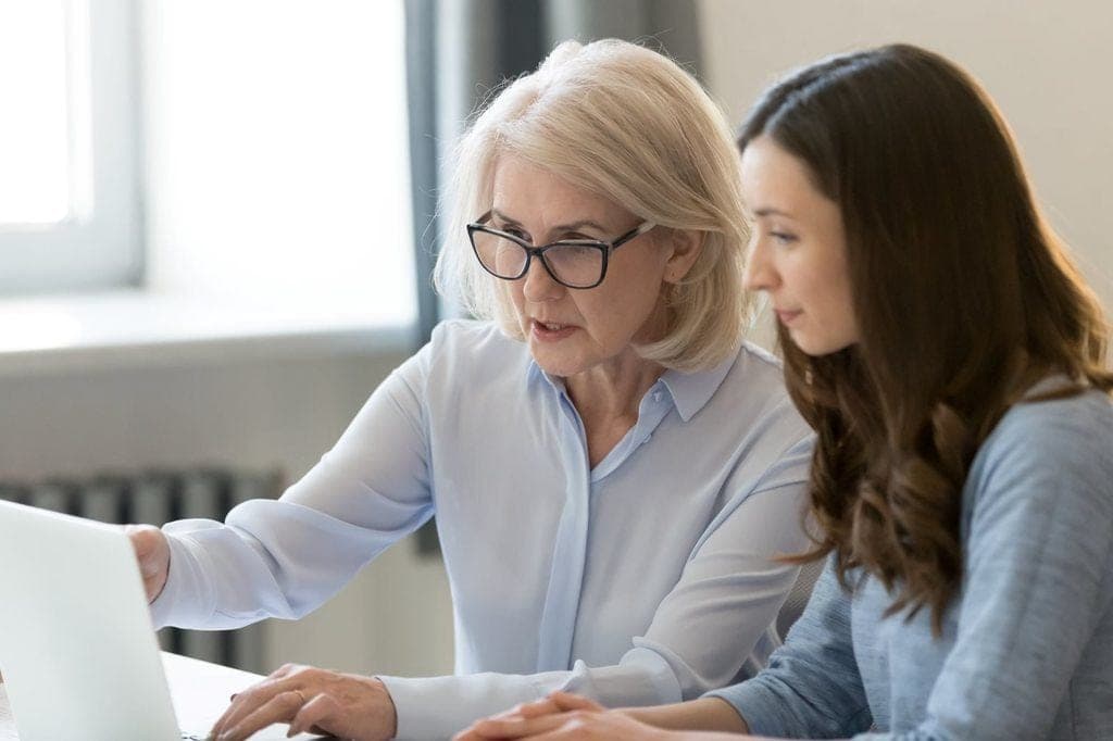 Business owner reviewing cash flow forecasts at a desk